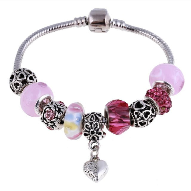 Pink glass beads and a silver charm for bottle bracelet